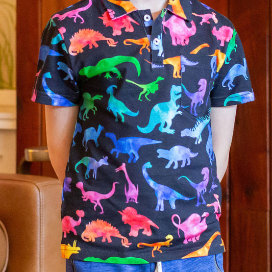 "Prehistoric Parade" Rainbow of Dinosaurs Short Sleeve Polo Shirt