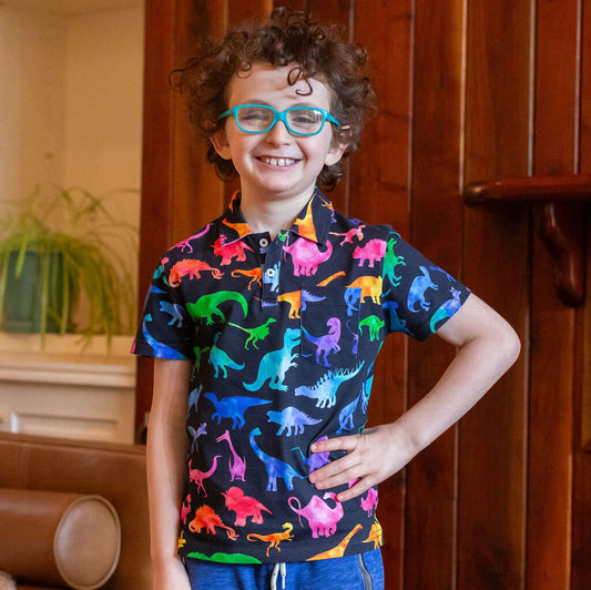 "Prehistoric Parade" Rainbow of Dinosaurs Short Sleeve Polo Shirt